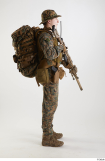 Photos Casey Schneider Paratrooper with gun holding gun standing whole…
